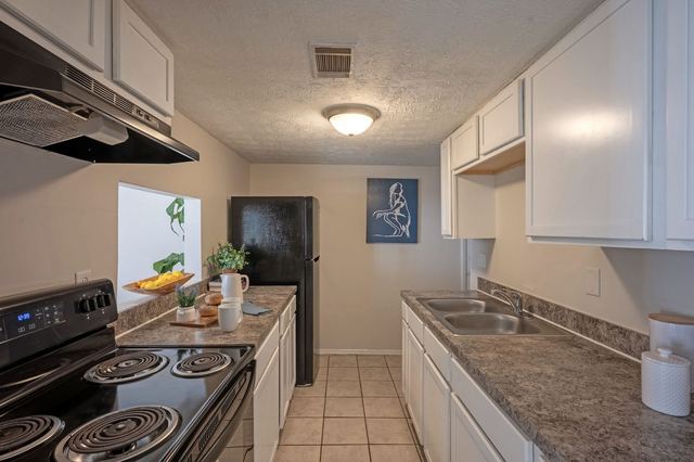 Renovated kitchen with grey countertops